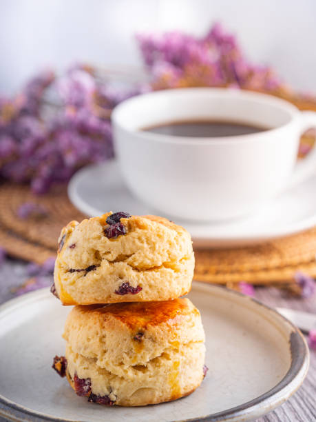 istock Traditional British scones with a white coffee cup cup and blurred background 1562715038