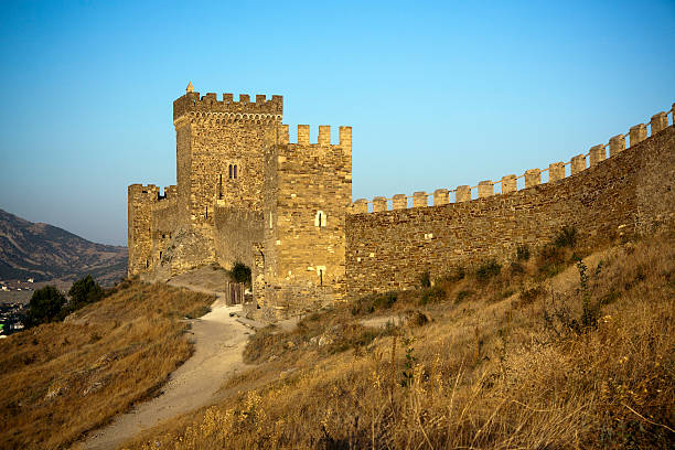 The Genoese Medieval fortress is situated exactly in the city of Sudak, Crimean peninsula, the Black sea South-Eastern coast. Fortress (as it's represented by now) is built in 14-th century is a combination of high towers (originally 18) and crenulated walls. It was one of the most important Genoese trading centers on the Great Silk Road from China.