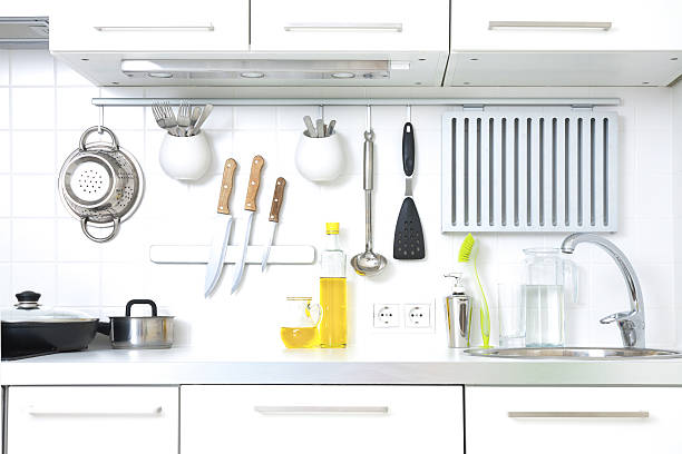 A modern kitchen complete with cooking utensils stock photo