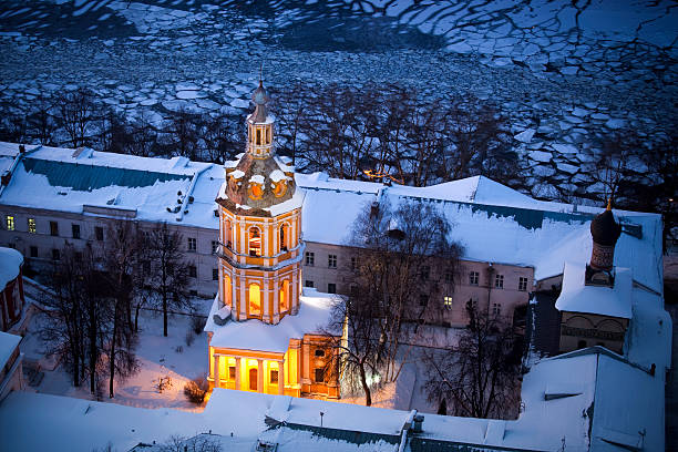 Bell tower of St. Andrew's monastery and frozen Moscow river. Moscow, Russiasunset