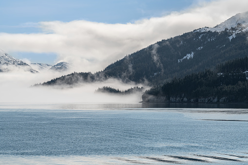 Fog on the mountains and sea in Passage Canal, Whittier, Alaska USA
