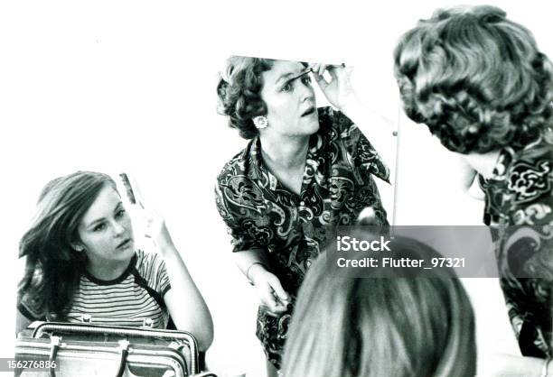 Mother And Daughter Putting On Makeup In Mirror Vintage Stock Photo - Download Image Now