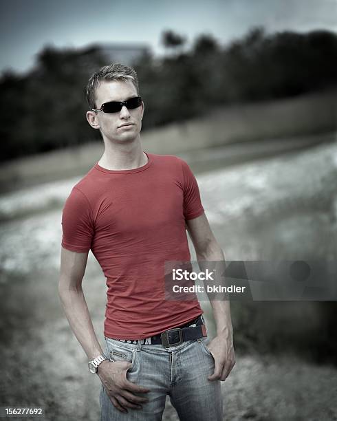 Portrait Of Young Man Wearing Sunglasses Outside Stock Photo - Download Image Now - Jeans, Rebellion, Adult