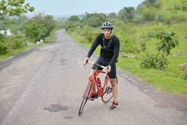 istock Cyclist cycling on a country road 1562780274