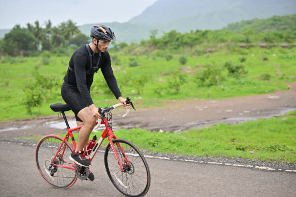 istock Cyclist training on a country road 1562785079