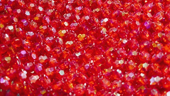Red gem glitter wallpaper to use in making background.