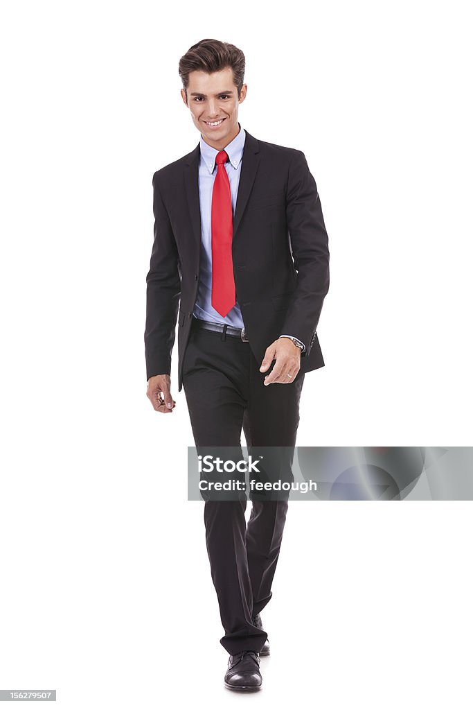 Jovem sorrindo negócios caminhando para a frente - Foto de stock de Adulto royalty-free