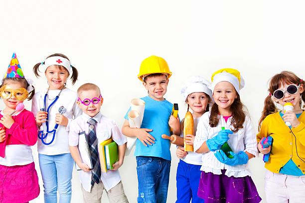 Kids playing in professions Group of seven children dressing up as professions dressing up stock pictures, royalty-free photos & images