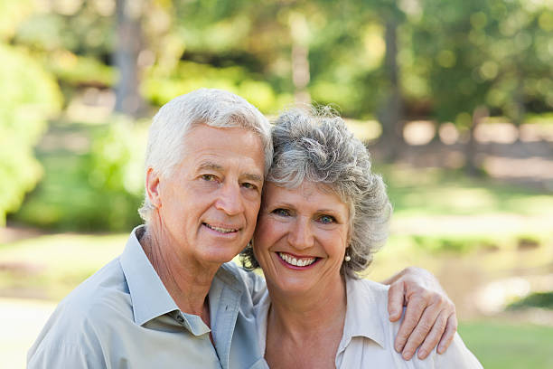 istock Husband and wife smiling at camera 156280587