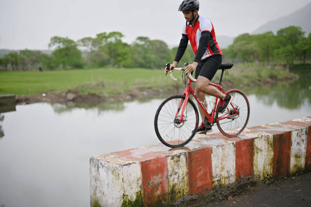 istock A  cyclist doing a cycling adventure on a Parapet 1562806399
