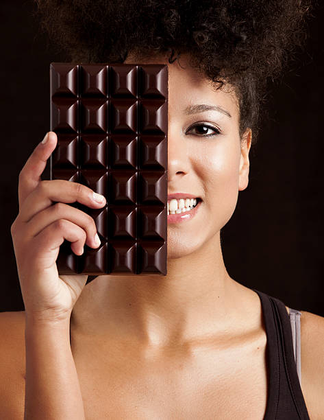 istock Woman with a chocolate bar 156280799