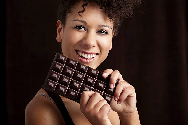 istock Woman with a chocolate bar 156280852