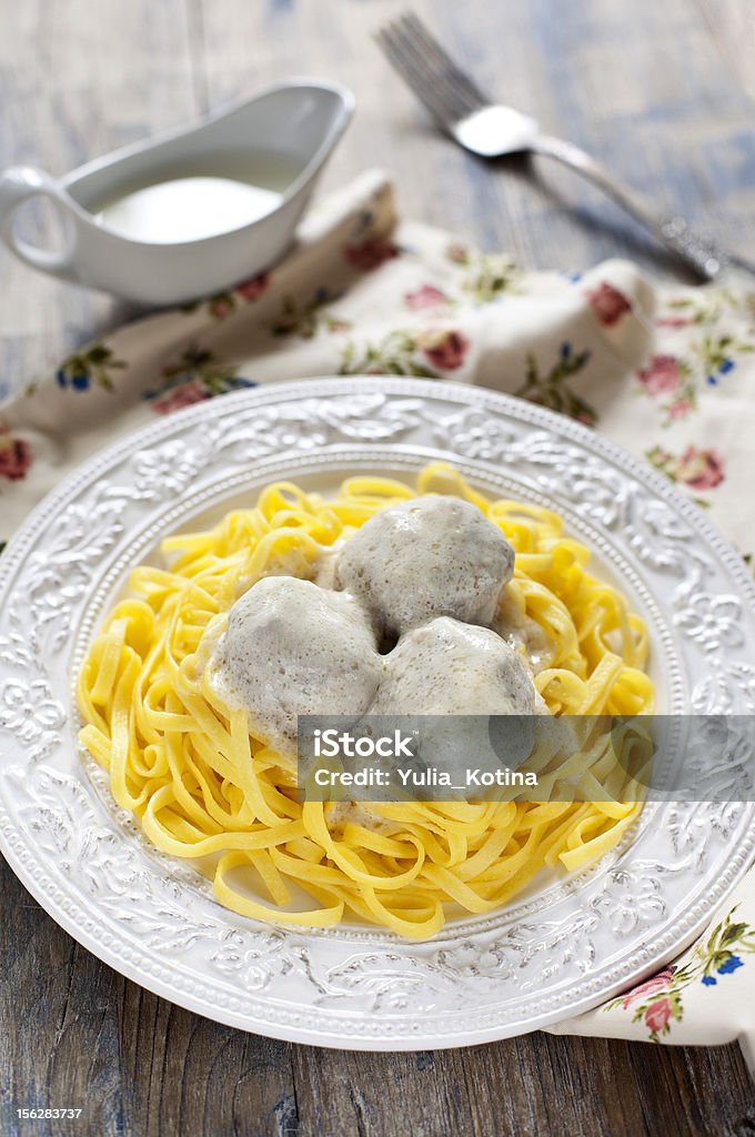 Meatballs with tagliatelli and white sauce Bechamel Sauce Stock Photo
