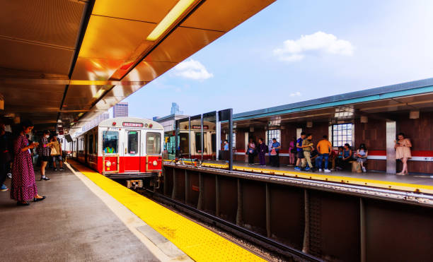 Empty subway cars awaiting and empty station on an oddly lit afternoon.