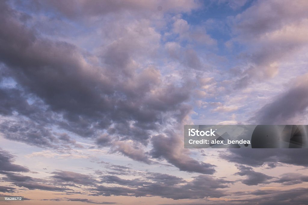 Dramatic Sky Image showing a dramatic sky with clouds at sunset. Blue Stock Photo