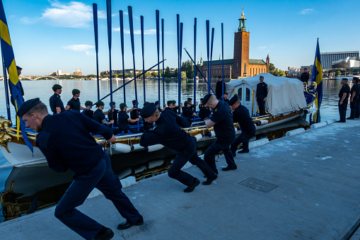 Stockholm, Sweden June 15, 2023 Swedish marines practice driving a parade rowboat at Riddarfjarden in the old town to transport the Royal family on the occasion of the City Hall 100 year anniversary.