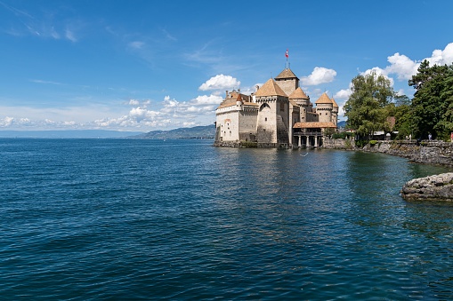 Montreux, Switzerland – August 15, 2022: The majestic Chillon Castle at the shore in Switzerland