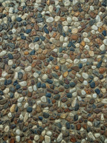 istock Selective focus of pebbles texture on the floor. 1562893536