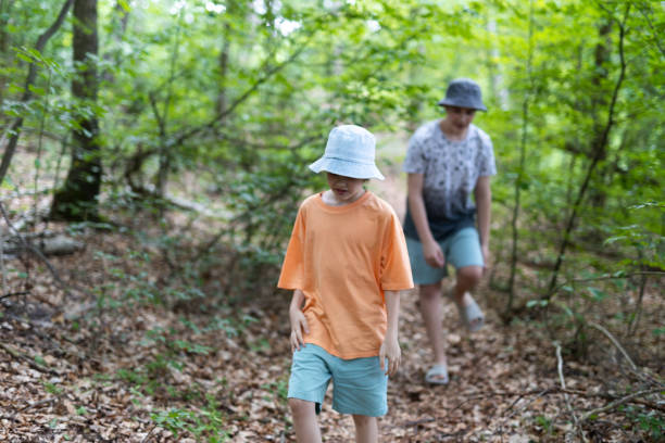 istock Young Boys walking in the forest 1562896795