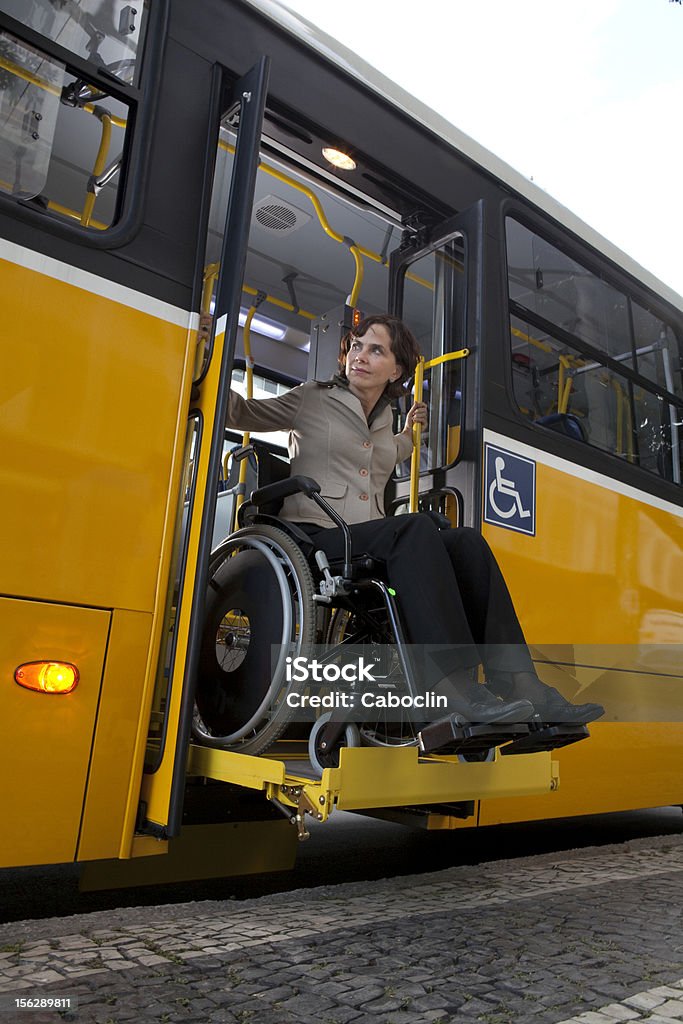 Accessibility Lift-equipped bus for wheelchairs users, with exclusive space for wheelchair inside the vehicle Bus Stock Photo