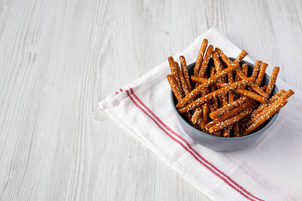 istock Baked Pretzel Sesame Sticks in a Bowl, low angle view. Copy space. 1562900066