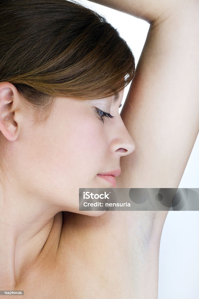 Young woman smelling her armpit Adult Stock Photo