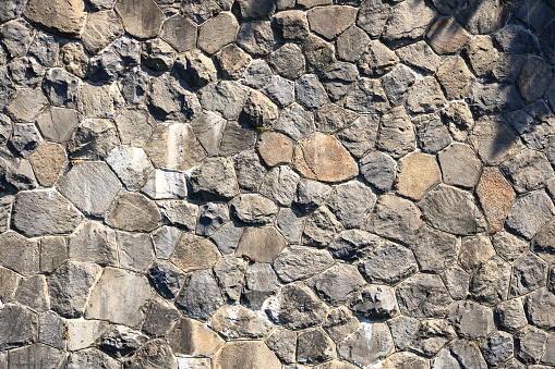 a gray Part of a stone wall, for background or texture