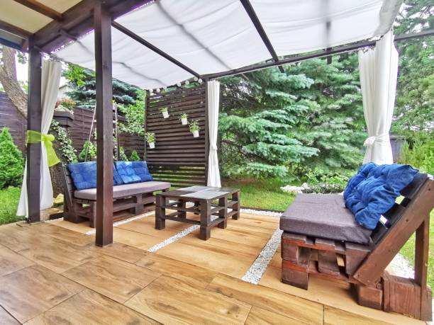 istock Terrace on the plot flowers and a roofed place for summer rest 1562923567