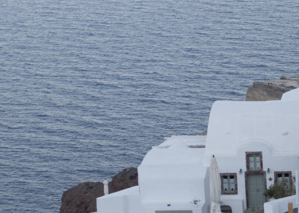 istock White cottage by the sea 1562926885
