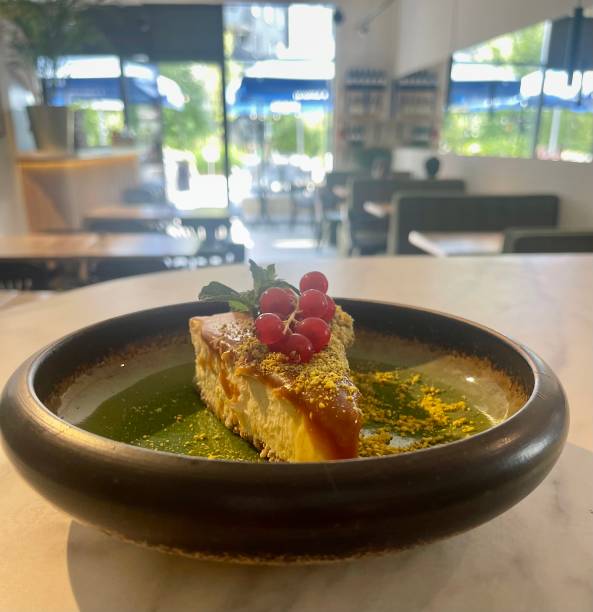 istock Cheesecake with pistachios and red currant 1562956704