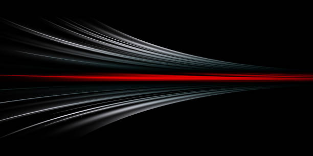 istock Abstract background of long exposure red tale light on black ,Technology background 1562962101