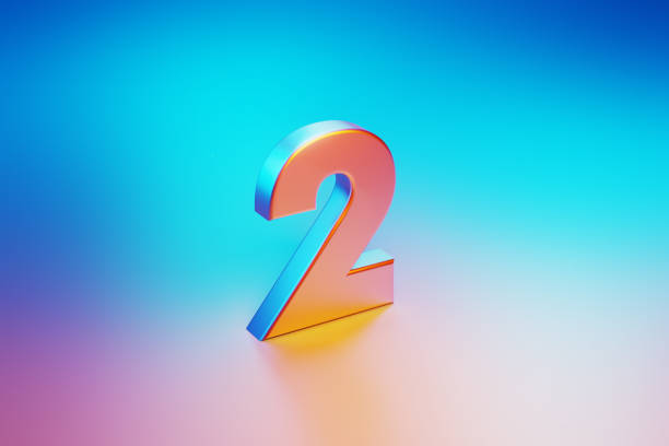 istock Metallic Number Two Illuminated By Blue And Pink Lights On Blue And Pink Background 1562968561