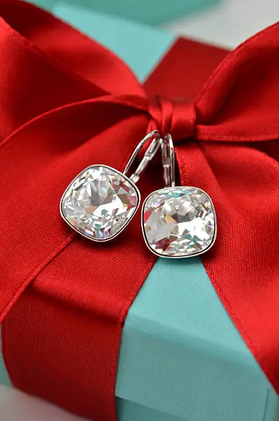 diamond earrings on a blue box