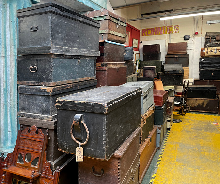 Suitcases and luggage trunks in a junk shop in Norwich