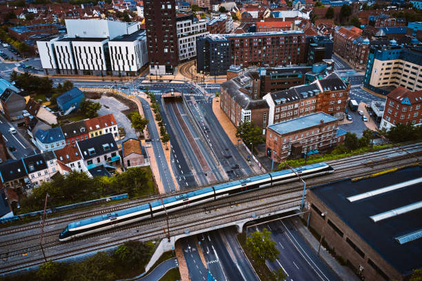 istock Passenger train crossing road on railway bridge 1562974268