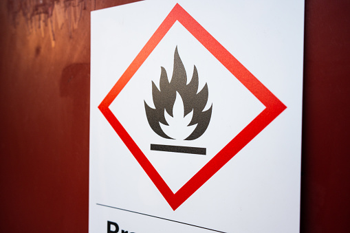 Flammable sign on the wall of a workshop.
