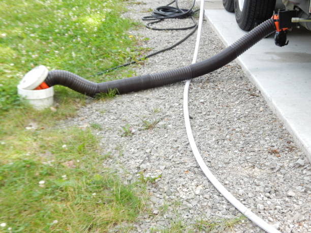 istock Sewer hose connected to a travel trailer 1562976171