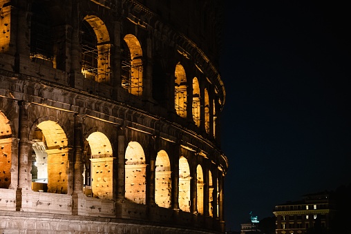 The view of the illuminated Colosseum at night. Rome, Italy.