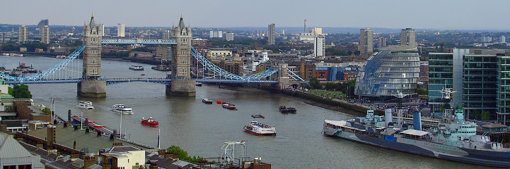 London, England - August 02, 2005: Panoramic view of Tower Bridge, the city hall and the HMS Belfast.