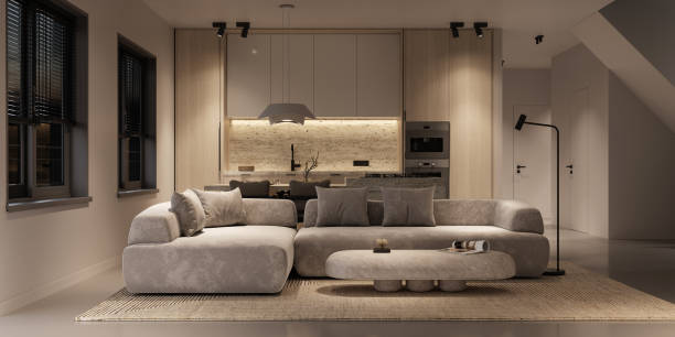 Beige living room interior with concrete floor, ceiling lamp and kitchen island. Panoramic window and night lighting, front view. 3d rendering. High quality 3d illustration