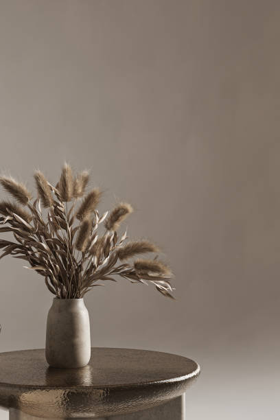 istock Conceptual interior room with stucco wall. Creative composition table with dry flowers in warm pastel color. Mockup empty background. 3d rendering. High quality 3d illustration 1562980697
