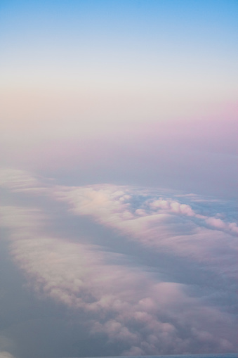 A sunrise flight over Maine. Clouds pink and white like giant swirls of cotton candy.