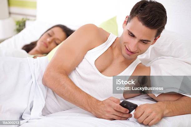 Cheating His Wife Stock Photo - Download Image Now - Hiding, Men, Mobile Phone