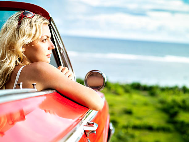 istock Woman in convertible car 156300562