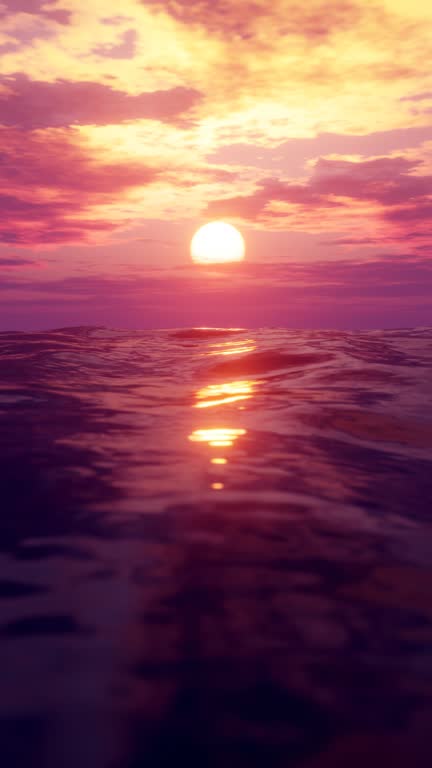 Waving ocean in sunset. Seamless loop. Vertical video.