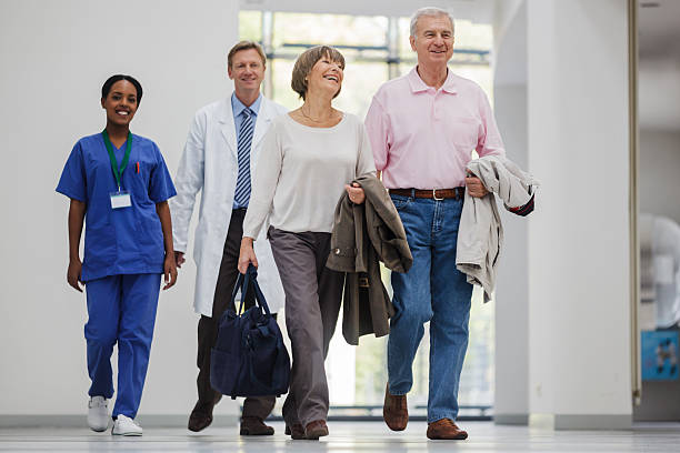 istock Senior Couple entering Hospital 156300778