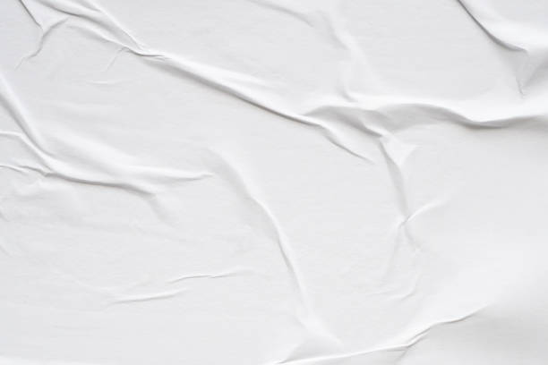 istock White blank crumpled and creased paper poster texture background 1563009234
