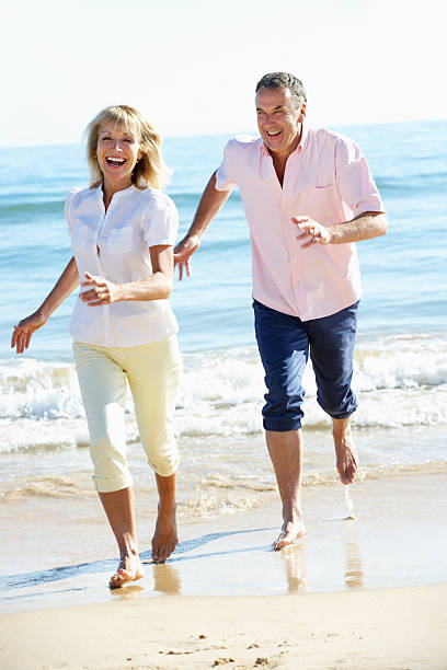 istock Senior Couple Enjoying Romantic Beach Holiday 156301371