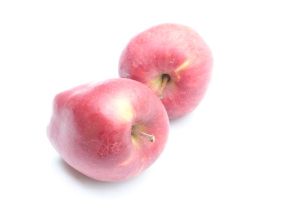 Fresh red apples on a white background , close up