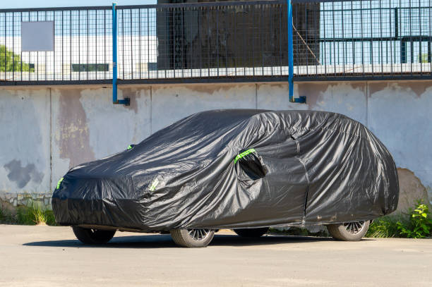 istock A car covered with a black cover 1563026523
